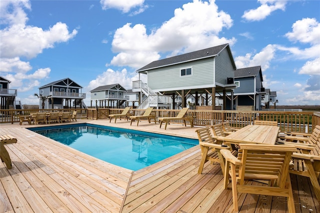 1057 Johnson Rd, Gilchrist, TX 77617 - view of swimming pool featuring outdoor dining space and a deck