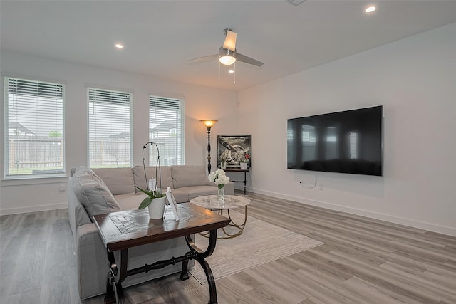12319 Brandenburg Gate Dr, Houston, TX 77047 - living area featuring baseboards, ceiling fan, light wood-style floors, and recessed lighting
