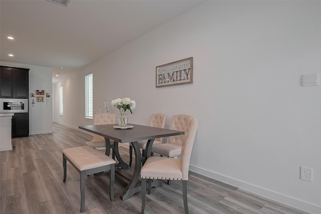 12319 Brandenburg Gate Dr, Houston, TX 77047 - dining space with light wood-type flooring, baseboards, and recessed lighting