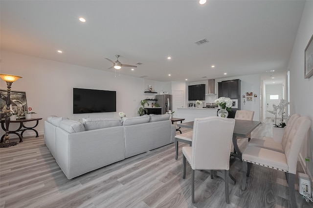 12319 Brandenburg Gate Dr, Houston, TX 77047 - living room with light wood-style floors, recessed lighting, and a ceiling fan