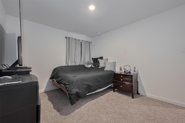 12319 Brandenburg Gate Dr, Houston, TX 77047 - bedroom featuring carpet floors, vaulted ceiling, and baseboards