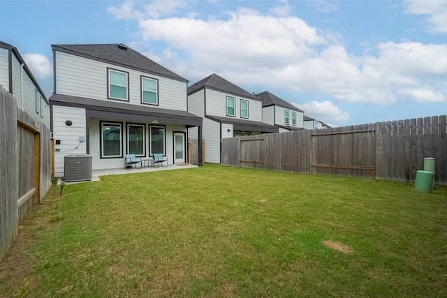 12319 Brandenburg Gate Dr, Houston, TX 77047 - rear view of property featuring central AC unit, a patio area, and roof with shingles