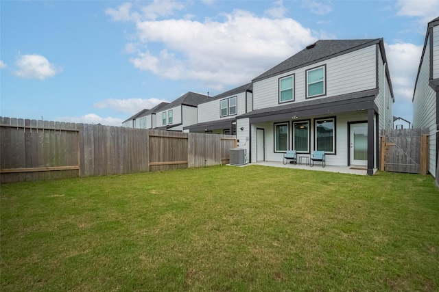 12319 Brandenburg Gate Dr, Houston, TX 77047 - rear view of property with central AC, a patio area, and a shingled roof