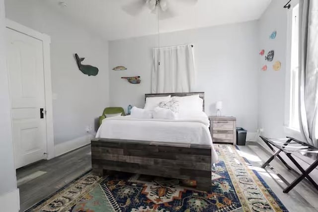 1514 18th St, Galveston, TX 77550 - bedroom with wood finished floors, a ceiling fan, and baseboards