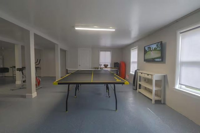 1514 18th St, Galveston, TX 77550 - game room with healthy amount of natural light and concrete flooring