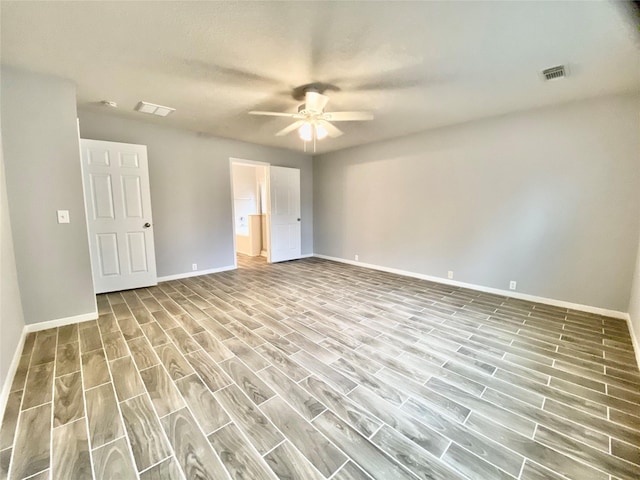 17419 Prospect Meadows Dr, Houston, TX 77095 - unfurnished bedroom featuring baseboards, wood finished floors, ceiling fan, and ensuite bath