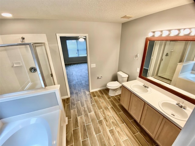 17419 Prospect Meadows Dr, Houston, TX 77095 - full bath featuring a garden tub, a shower stall, wood finished floors, a textured ceiling, and double vanity