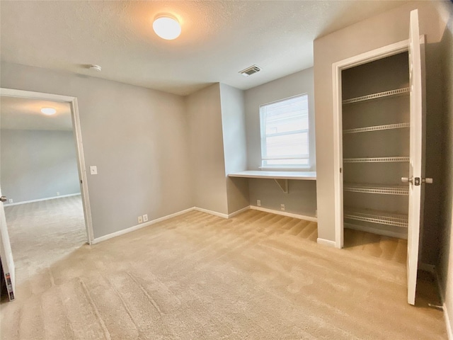 17419 Prospect Meadows Dr, Houston, TX 77095 - unfurnished bedroom with carpet, baseboards, and a textured ceiling