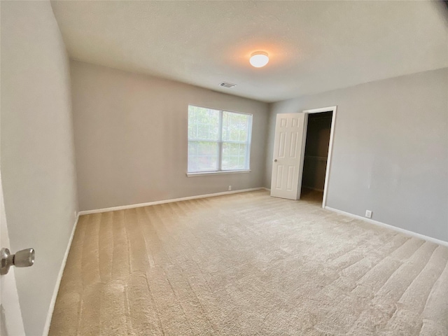 17419 Prospect Meadows Dr, Houston, TX 77095 - unfurnished bedroom featuring baseboards and light colored carpet