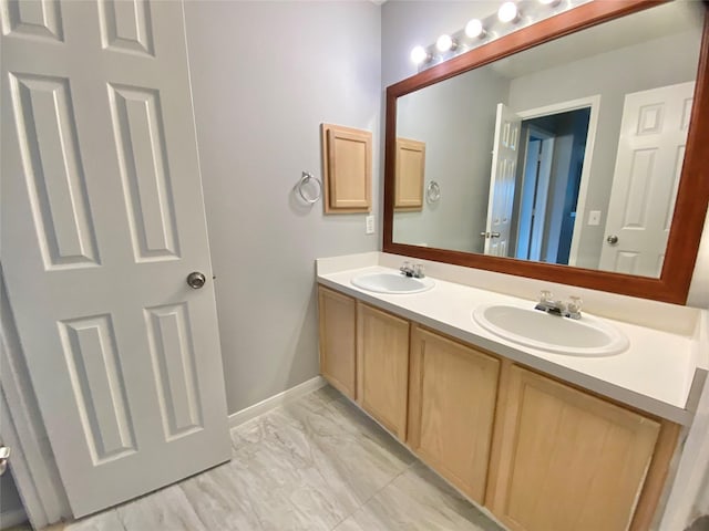 17419 Prospect Meadows Dr, Houston, TX 77095 - full bathroom with double vanity, marble finish flooring, and baseboards