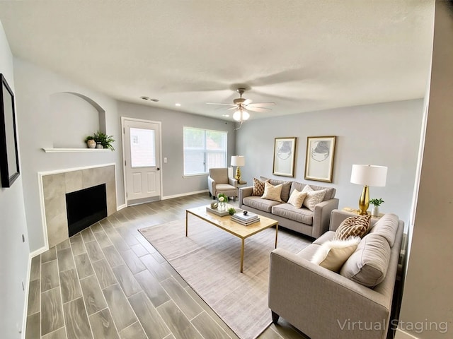 17419 Prospect Meadows Dr, Houston, TX 77095 - living area with baseboards, ceiling fan, a tile fireplace, recessed lighting, and wood finished floors