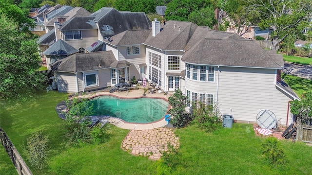 7923 Vintage Creek Dr, Spring, TX 77379 - back of house with a patio area, a chimney, french doors, an outdoor pool, and a shingled roof
