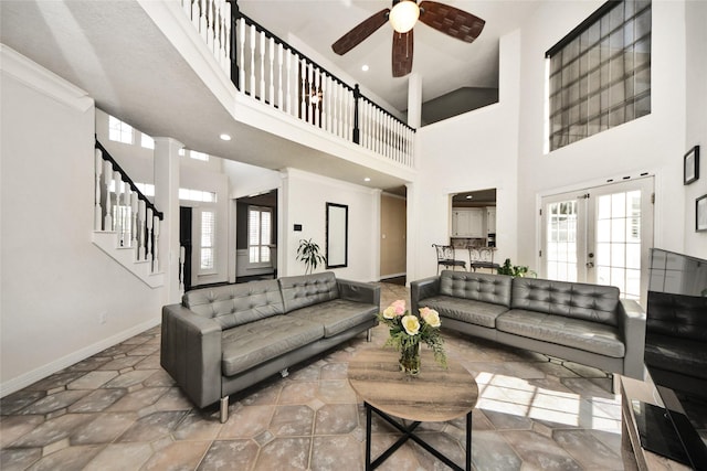 7923 Vintage Creek Dr, Spring, TX 77379 - living area with a high ceiling, a ceiling fan, baseboards, stairs, and recessed lighting