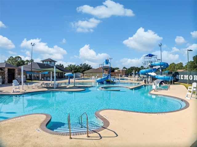 7923 Vintage Creek Dr, Spring, TX 77379 - community pool featuring a water slide, a water play area, and a patio