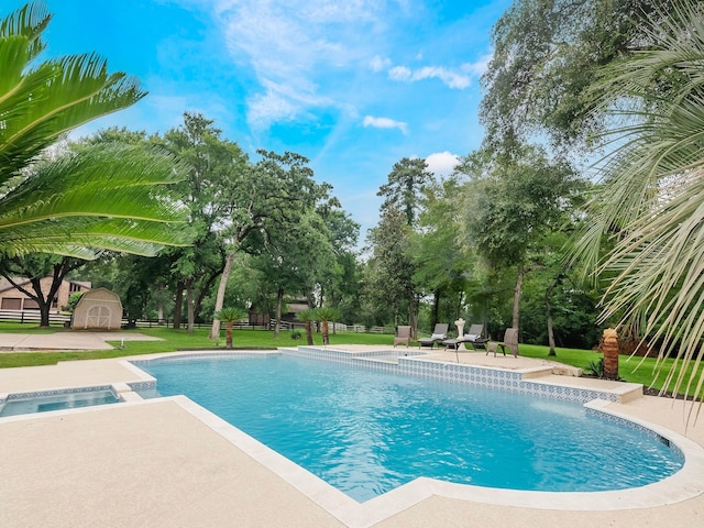 23226 Oak Hollow Ln, Tomball, TX 77377 - swimming pool with a patio area and an in-ground hot tub