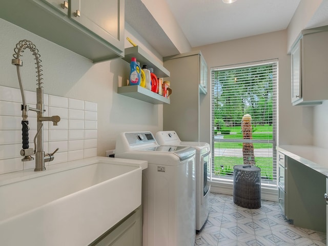 23226 Oak Hollow Ln, Tomball, TX 77377 - laundry area with cabinet space and washer and clothes dryer