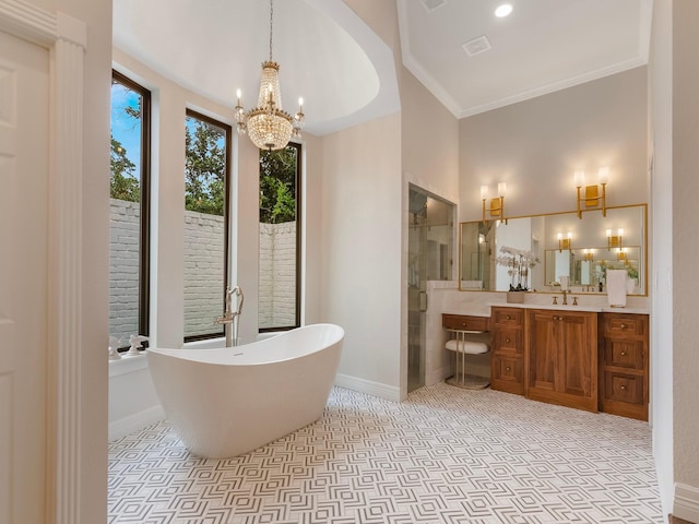 23226 Oak Hollow Ln, Tomball, TX 77377 - bathroom with a chandelier, vanity, a shower stall, a freestanding tub, and crown molding
