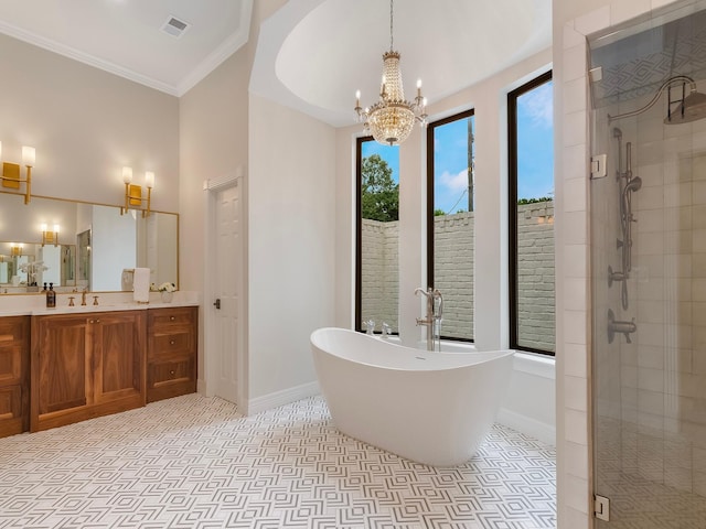 23226 Oak Hollow Ln, Tomball, TX 77377 - bathroom featuring a stall shower, vanity, a freestanding tub, a chandelier, and crown molding