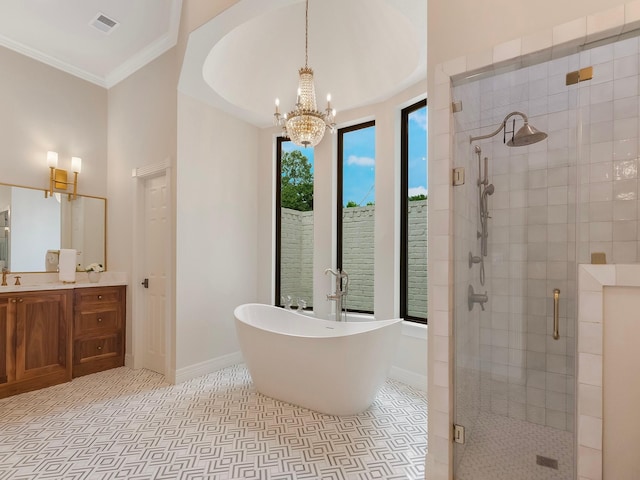 23226 Oak Hollow Ln, Tomball, TX 77377 - full bathroom featuring a stall shower, a soaking tub, vanity, a chandelier, and baseboards