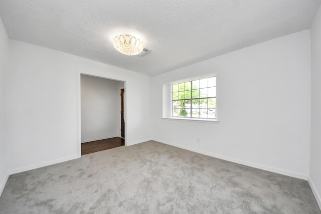 2302 Sun Spring Ct, Spring, TX 77373 - empty room with carpet floors, baseboards, and a textured ceiling