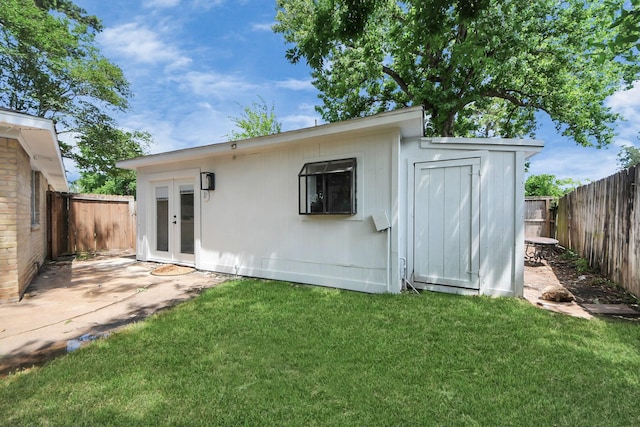 2302 Sun Spring Ct, Spring, TX 77373 - back of property featuring french doors, a patio, and an outbuilding