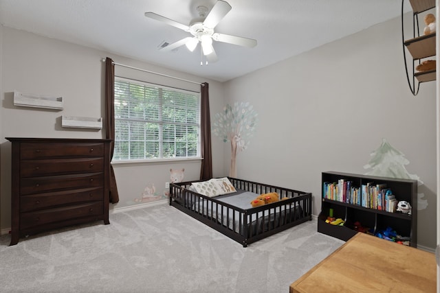 11402 Willis Waukegan Rd, Conroe, TX 77303 - carpeted bedroom with baseboards, a nursery area, and ceiling fan
