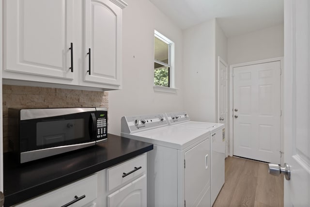 11402 Willis Waukegan Rd, Conroe, TX 77303 - washroom with washing machine and dryer and light wood-style flooring