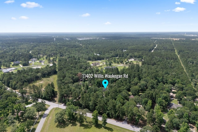 11402 Willis Waukegan Rd, Conroe, TX 77303 - view of property location with a heavily wooded area
