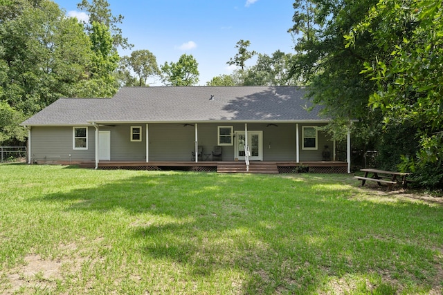 11402 Willis Waukegan Rd, Conroe, TX 77303 - back of property with a wooden deck, a ceiling fan, roof with shingles, and french doors