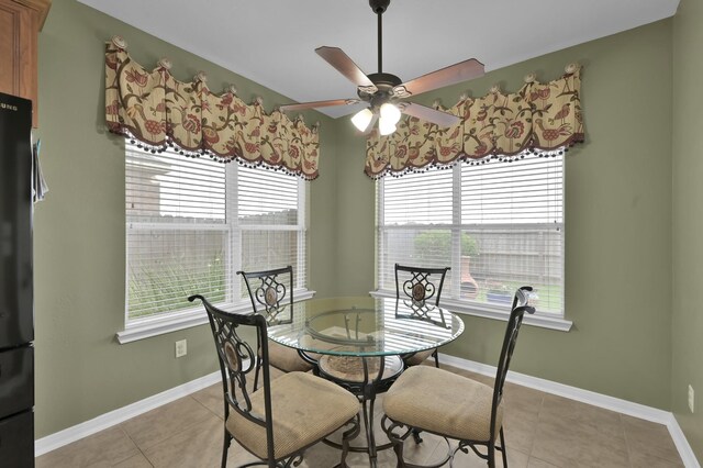 20530 Saddleback Chase Ln, Cypress, TX 77433 - dining space with healthy amount of natural light, ceiling fan, light tile patterned floors, and baseboards