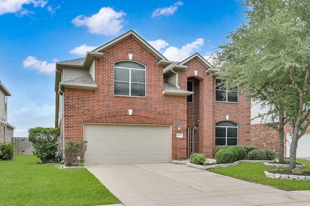 20530 Saddleback Chase Ln, Cypress, TX 77433 - traditional-style house featuring a front yard, concrete driveway, an attached garage, roof with shingles, and brick siding