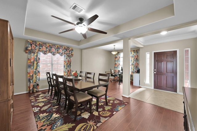 20530 Saddleback Chase Ln, Cypress, TX 77433 - dining room featuring ceiling fan, baseboards, wood finished floors, and a tray ceiling