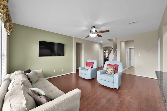 20530 Saddleback Chase Ln, Cypress, TX 77433 - living area with baseboards, ceiling fan, dark wood-style floors, and stairs