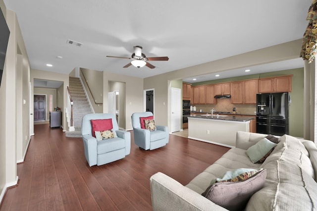 20530 Saddleback Chase Ln, Cypress, TX 77433 - living area featuring ceiling fan, stairway, baseboards, recessed lighting, and dark wood-type flooring