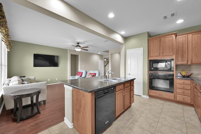 20530 Saddleback Chase Ln, Cypress, TX 77433 - kitchen with black appliances, a sink, open floor plan, a kitchen island with sink, and ceiling fan