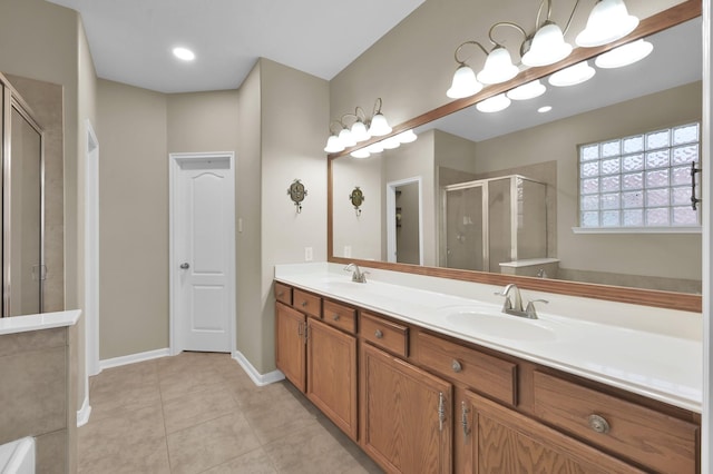 20530 Saddleback Chase Ln, Cypress, TX 77433 - bathroom featuring a shower stall, double vanity, tile patterned floors, and baseboards
