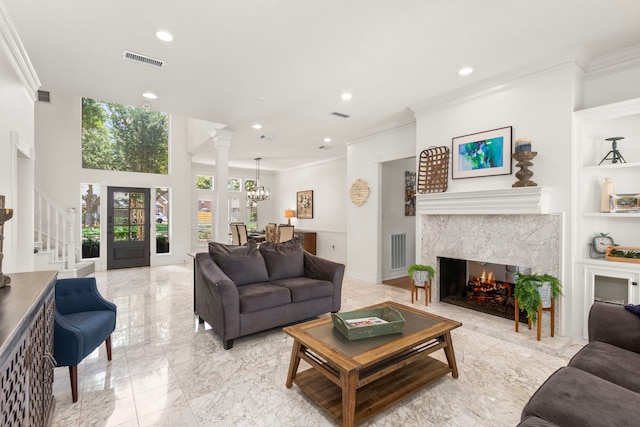 2623 Old S Dr, Richmond, TX 77406 - living area featuring ornamental molding, a premium fireplace, stairway, light marble finish flooring, and recessed lighting