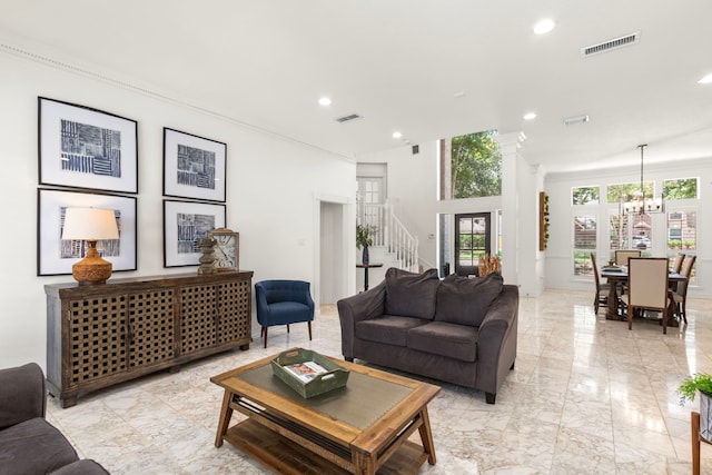 2623 Old S Dr, Richmond, TX 77406 - living room featuring plenty of natural light, light marble finish floors, a chandelier, stairway, and recessed lighting