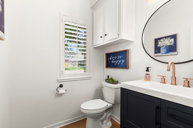 2623 Old S Dr, Richmond, TX 77406 - half bathroom with baseboards, vanity, plenty of natural light, and toilet