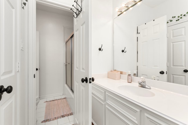2623 Old S Dr, Richmond, TX 77406 - full bath with vanity, tile patterned floors, and enclosed tub / shower combo