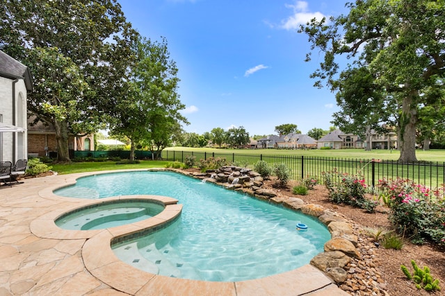 2623 Old S Dr, Richmond, TX 77406 - view of pool with a fenced backyard, a pool with connected hot tub, a patio, and a residential view