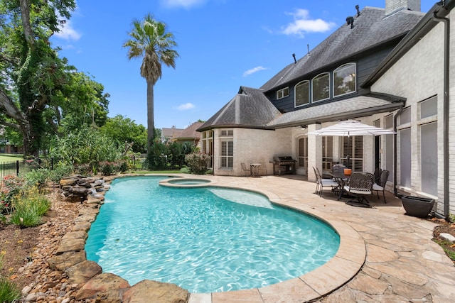 2623 Old S Dr, Richmond, TX 77406 - view of swimming pool featuring a grill, a patio, and a pool with connected hot tub