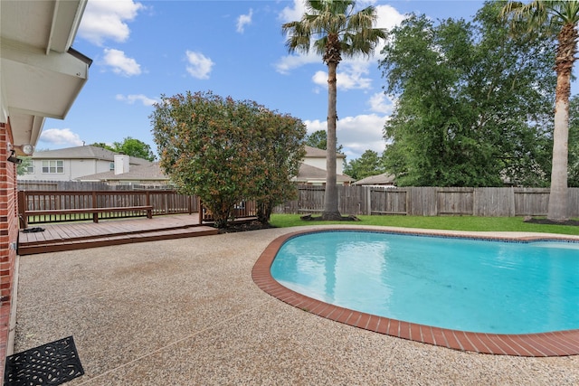 19126 Edens Dawn Dr, Tomball, TX 77375 - view of pool featuring a fenced backyard, a wooden deck, and a patio
