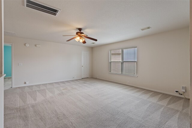 19126 Edens Dawn Dr, Tomball, TX 77375 - spare room featuring ceiling fan, light colored carpet, and baseboards