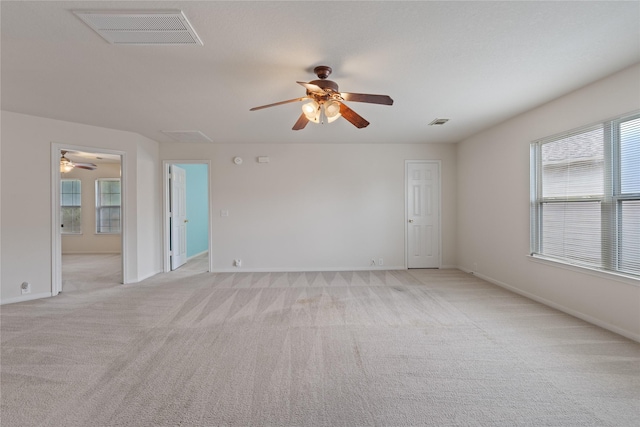 19126 Edens Dawn Dr, Tomball, TX 77375 - unfurnished room featuring a ceiling fan, light colored carpet, baseboards, and attic access