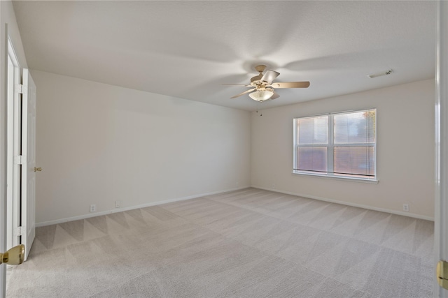 19126 Edens Dawn Dr, Tomball, TX 77375 - unfurnished room with light carpet, ceiling fan, and baseboards