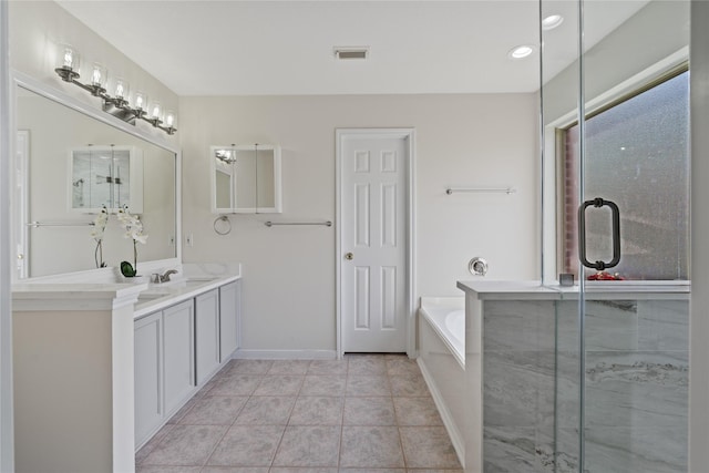 19126 Edens Dawn Dr, Tomball, TX 77375 - bathroom featuring a garden tub, vanity, an enclosed shower, tile patterned flooring, and baseboards