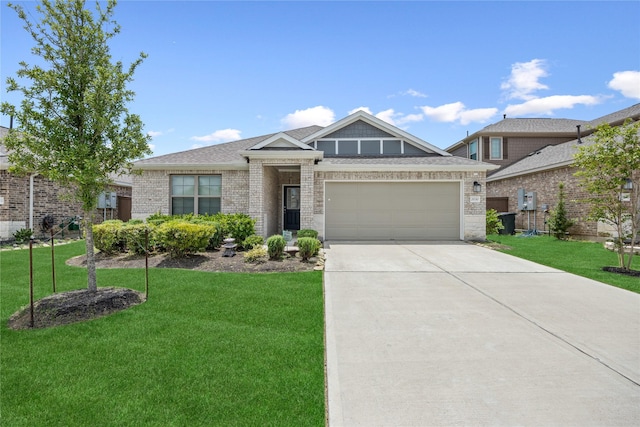 2030 Boreas Ln, Baytown, TX 77523 - view of front of house featuring concrete driveway, a front yard, and a garage