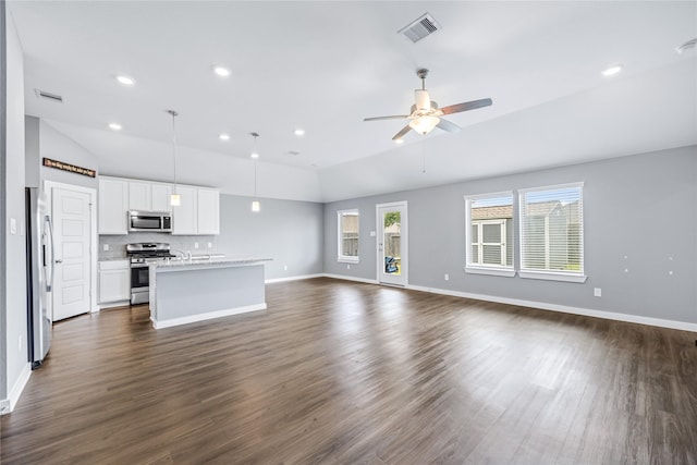 2030 Boreas Ln, Baytown, TX 77523 - unfurnished living room with vaulted ceiling, dark wood-style flooring, baseboards, recessed lighting, and a ceiling fan