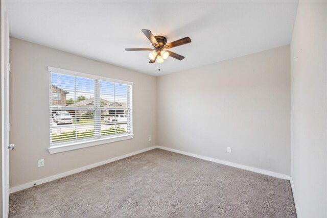 2030 Boreas Ln, Baytown, TX 77523 - carpeted empty room featuring a ceiling fan and baseboards